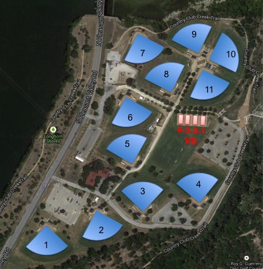 Aerial map of Krieg Softball Complex showing 11 numbered fields along S. Pleasant Valley Road in Austin. Fields 1-4 are in the southern section, fields 5-8 in the center, and fields 9-11 in the north. Volleyball courts are between fields 4 and 11.